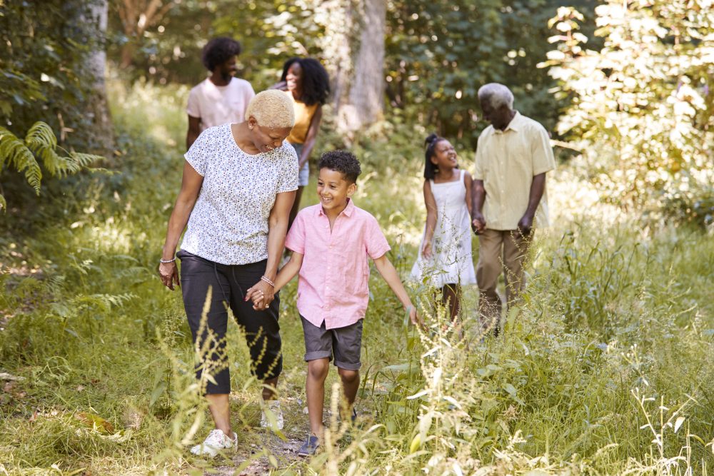 seniors on nature walk with grandkids